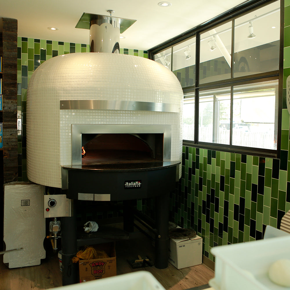 A Napoli Fired oven with a clean and pure white finish.
