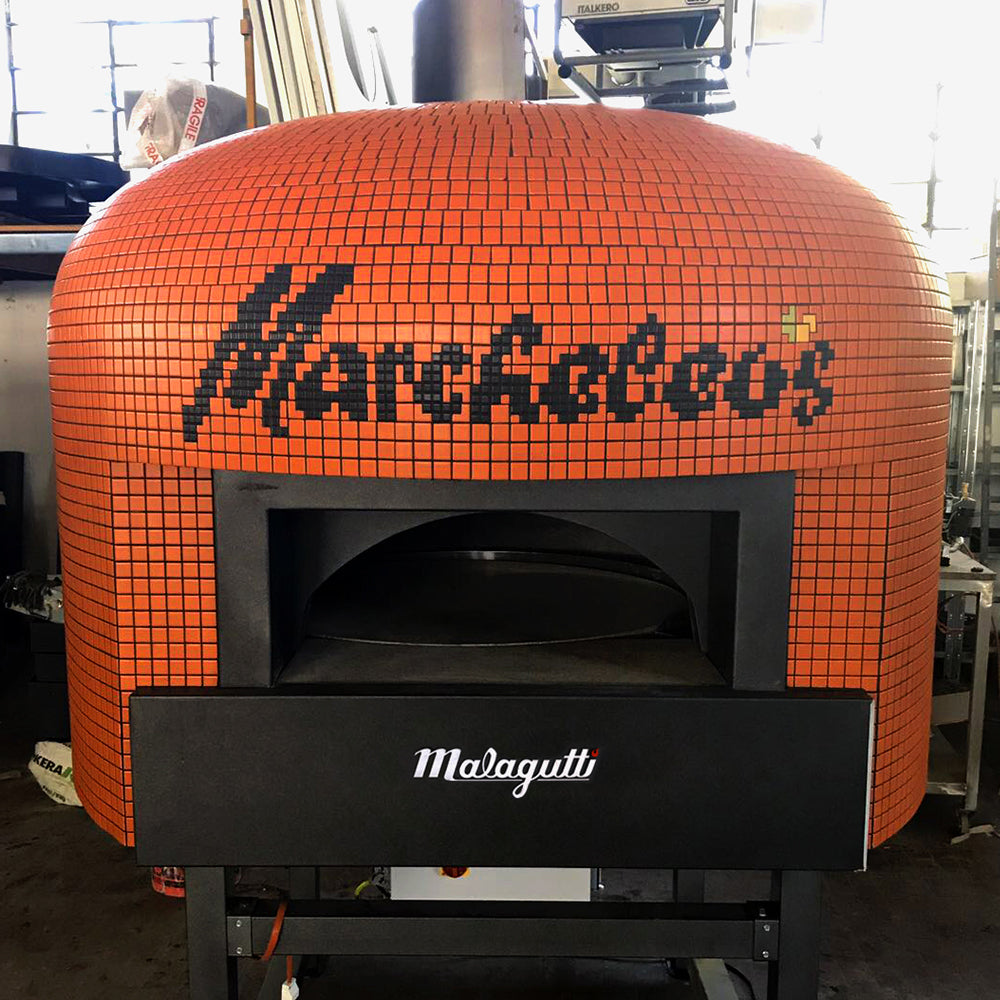 An orange Napoli fired oven with a custom branded tiling for Marcheleos.
