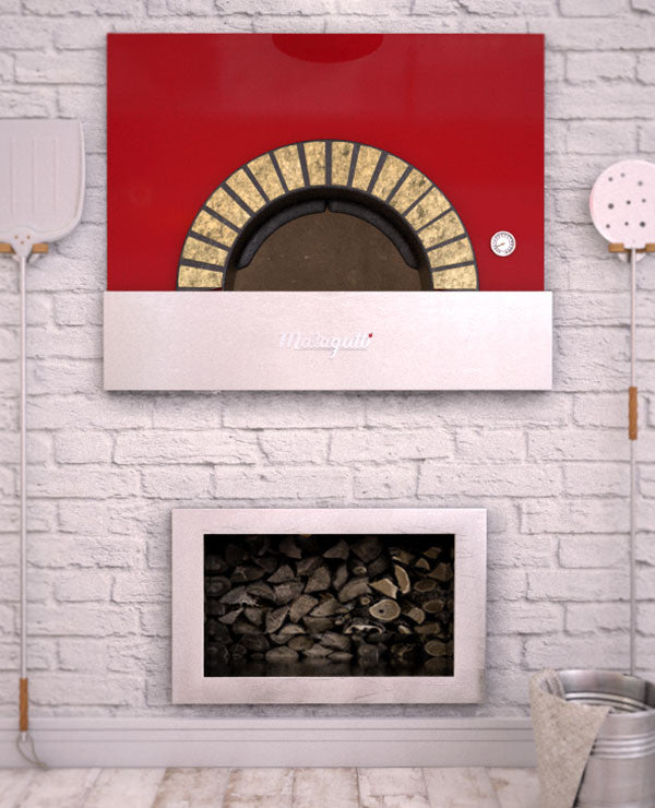 Milano fired oven with a red finish enclosed within a decorated brick wall.